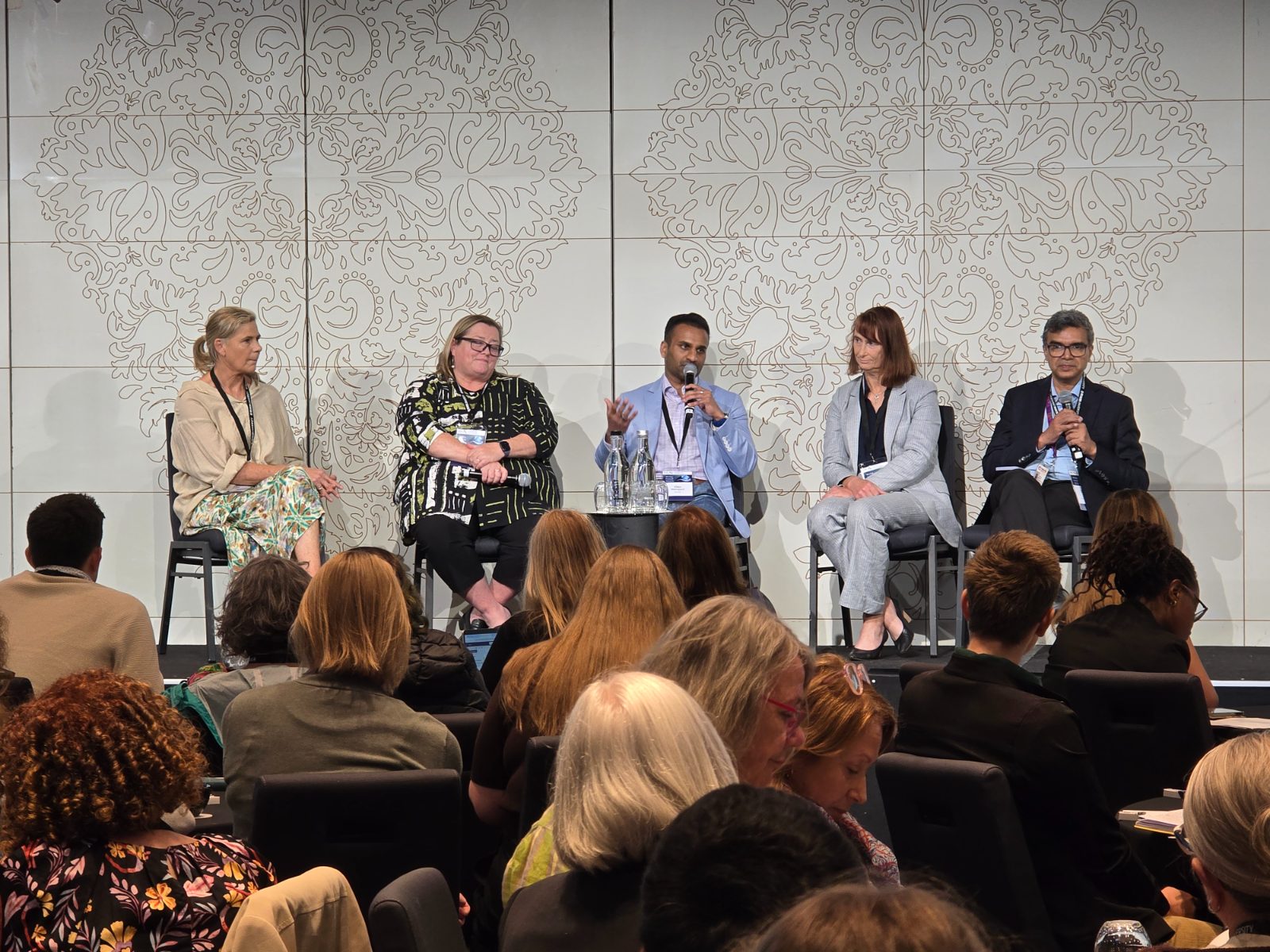 Chin Weerappuli speaking on a panel at the ACTEC conference in Melbourne